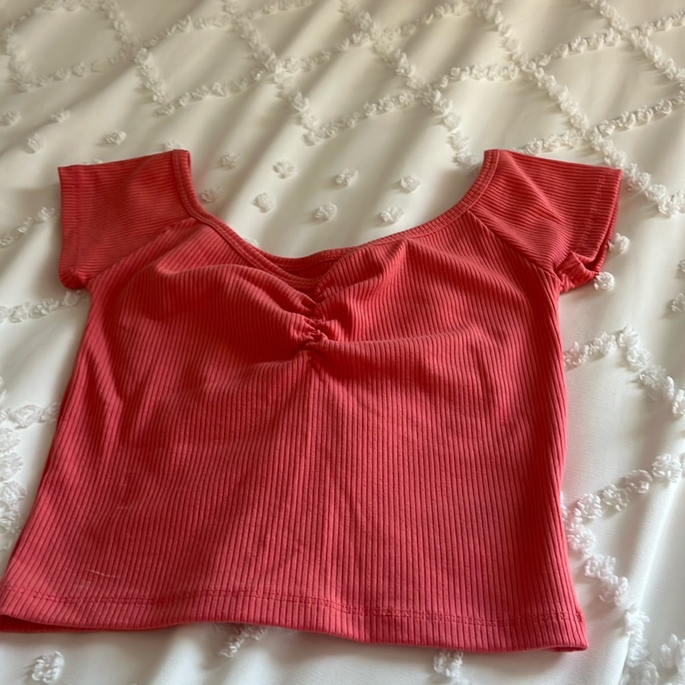 Pretty coral top from American Eagle. Size small